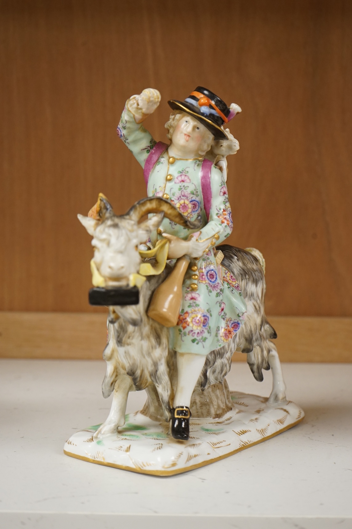 A 19th century German porcelain group of Count Von Bruhl's Tailor, 19cm wide